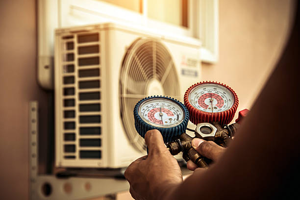 Professional Air Conditioning Service technician working in Arnold, MO